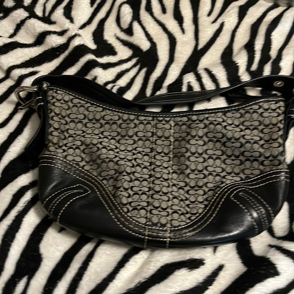 Small coach purse. No tears or rips black with coach emblem